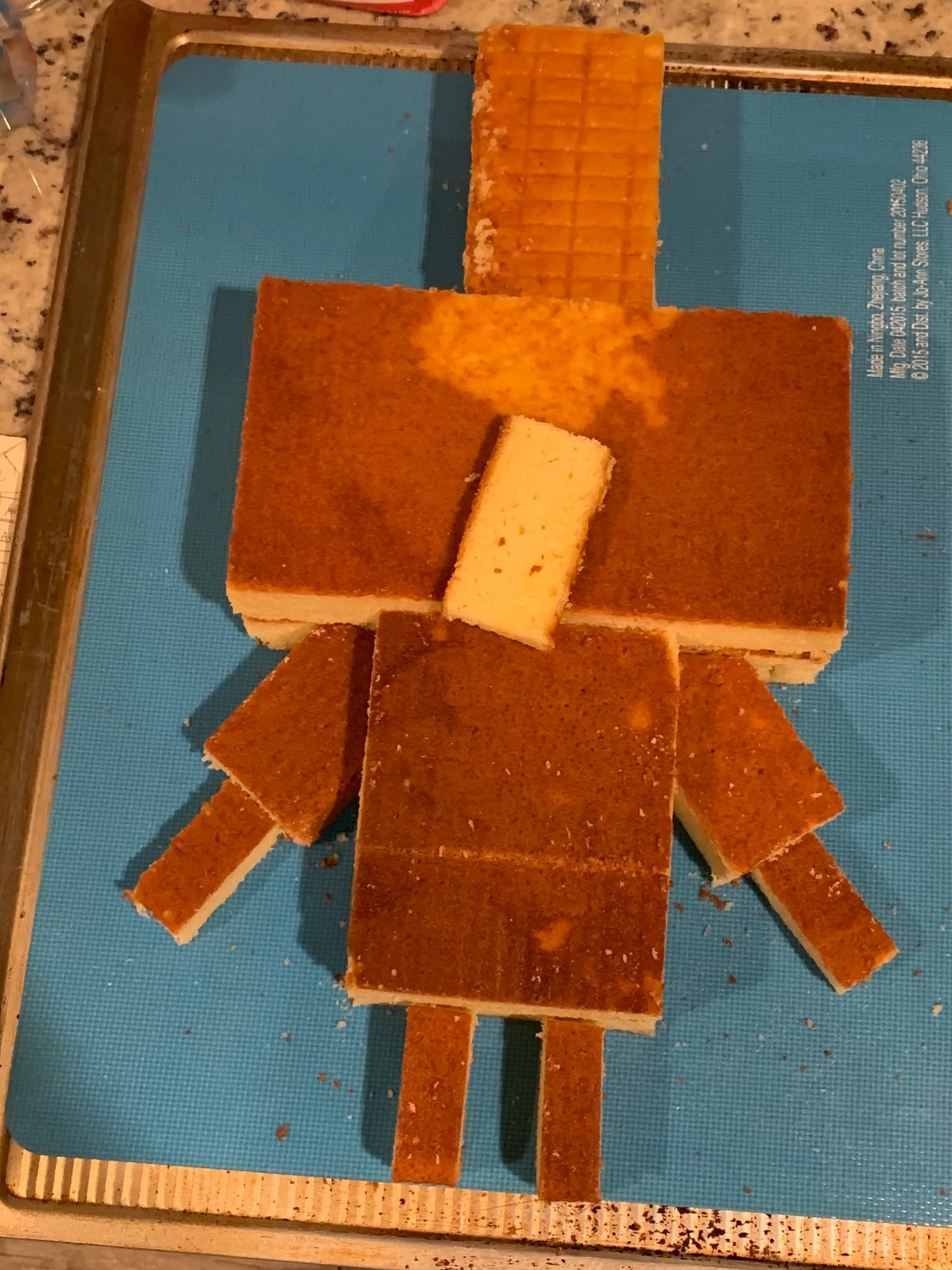 Arch Illager cake assembled in layers, showing the cake’s shape before icing.