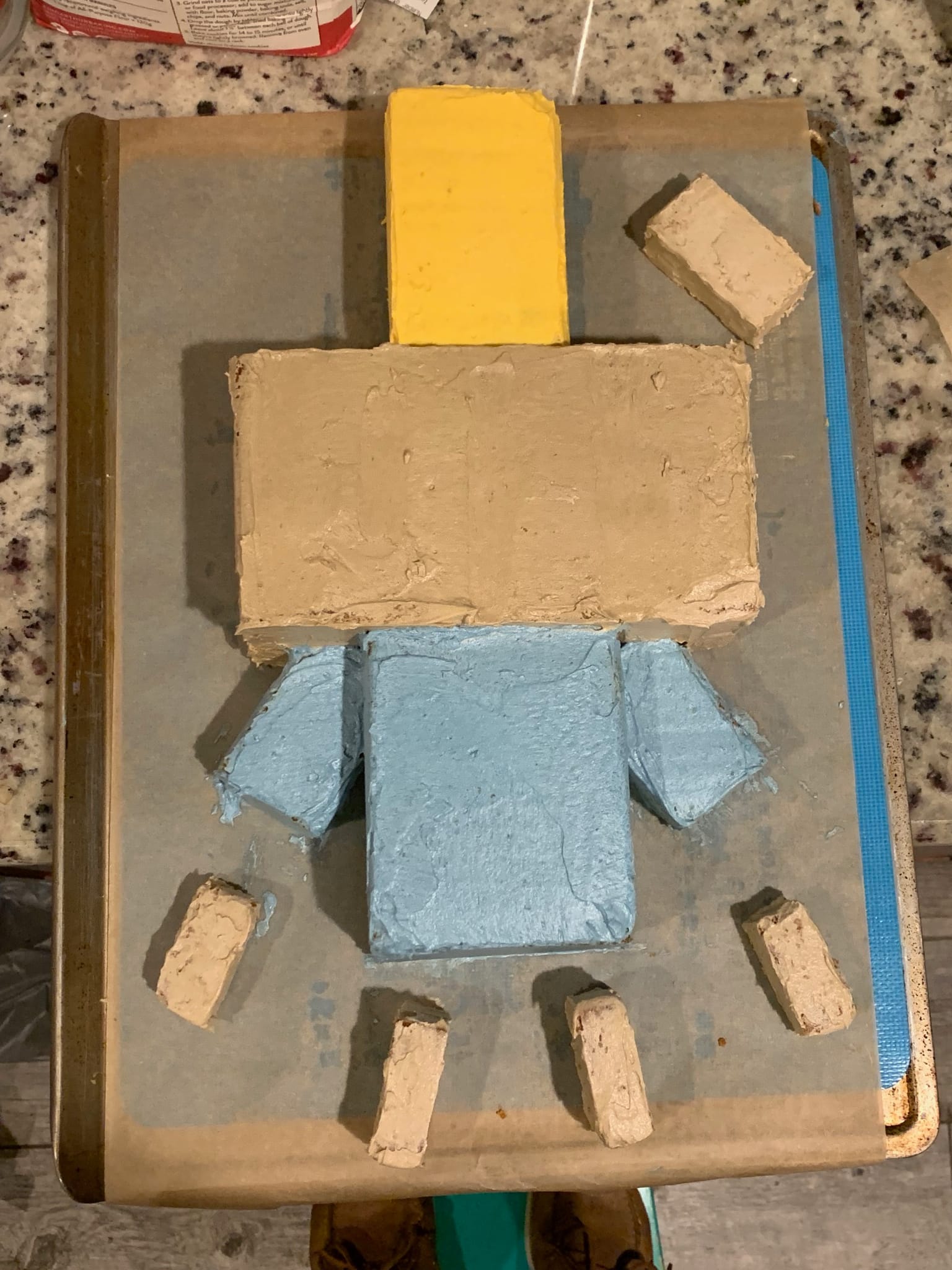 Arch Illager cake with a base layer of icing applied.