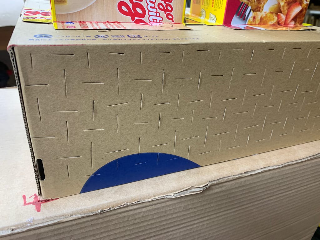 Close-up of weakening cuts made on the piñata’s surface to help kids break it.