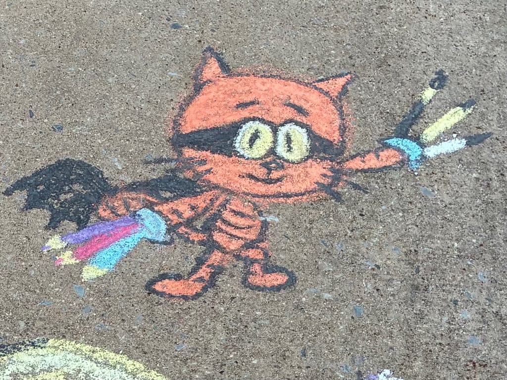 Close-up of a chalk drawing of Cat Kid.