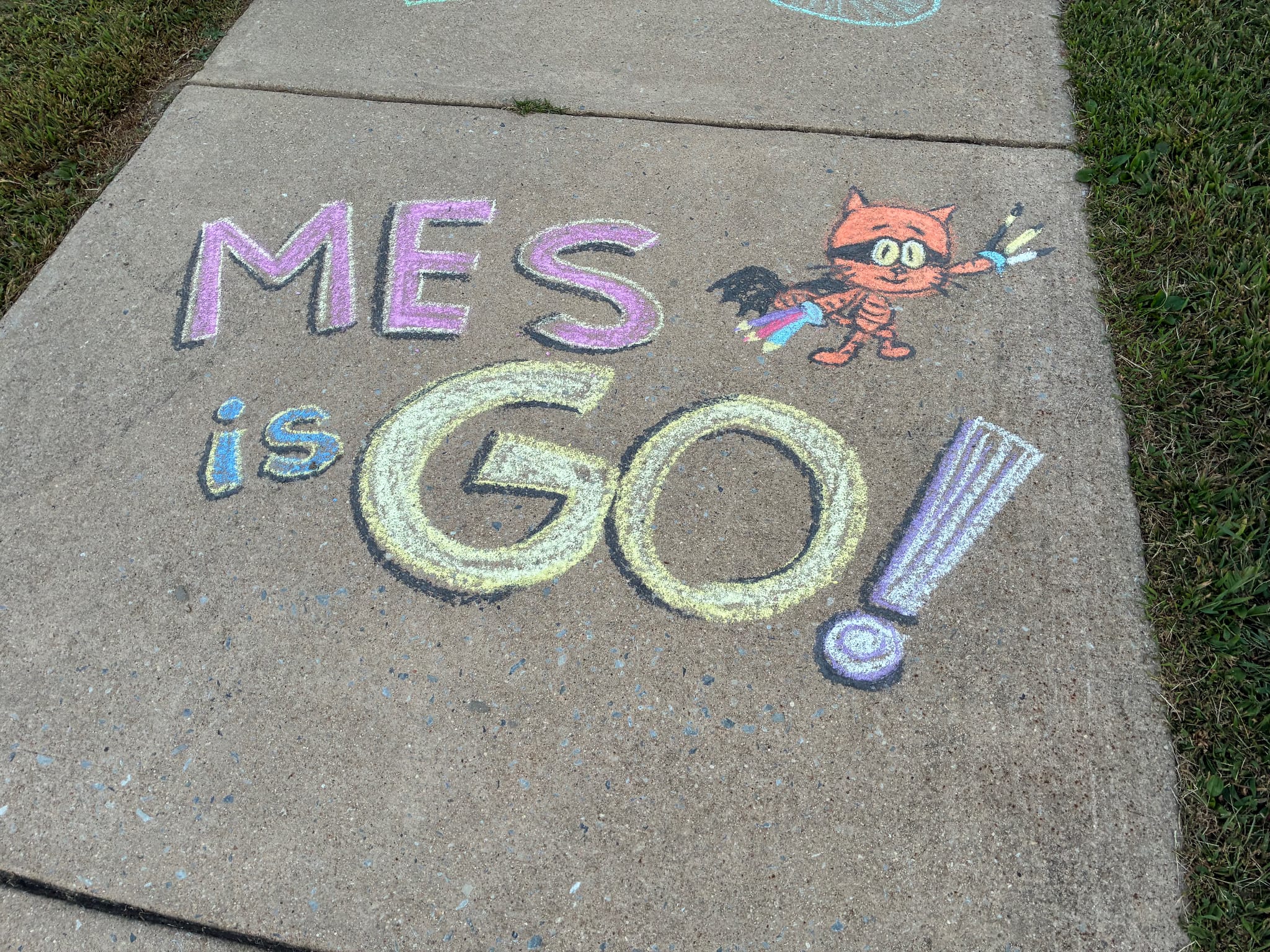 Chalk drawing of Cat Kid (Lil' Petey) added next to Dog Man.