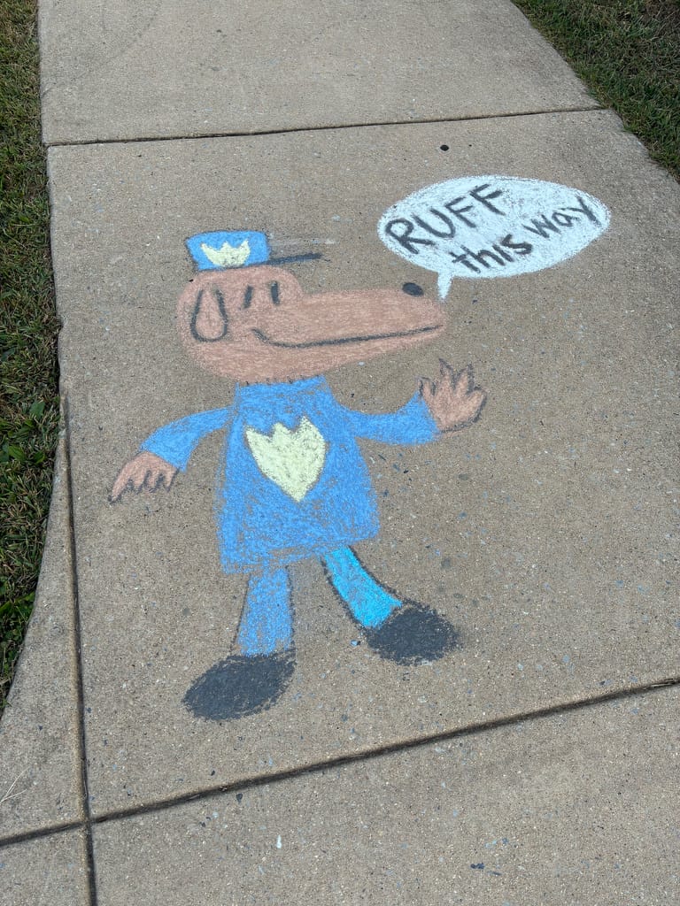 Chalk drawing of Dog Man by another artist.